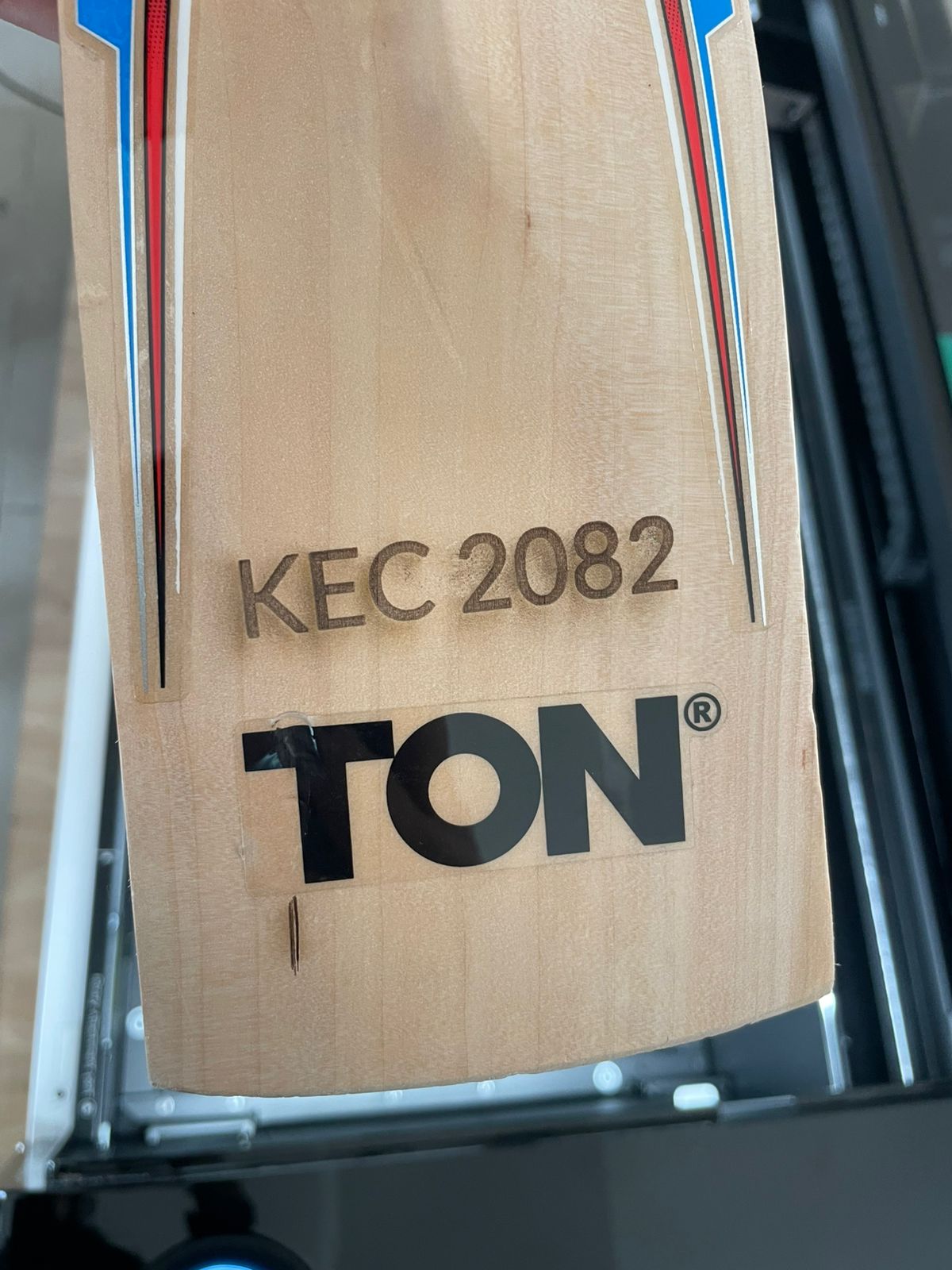 Laser engraved SM cricket bat with KEC 2082 inscription